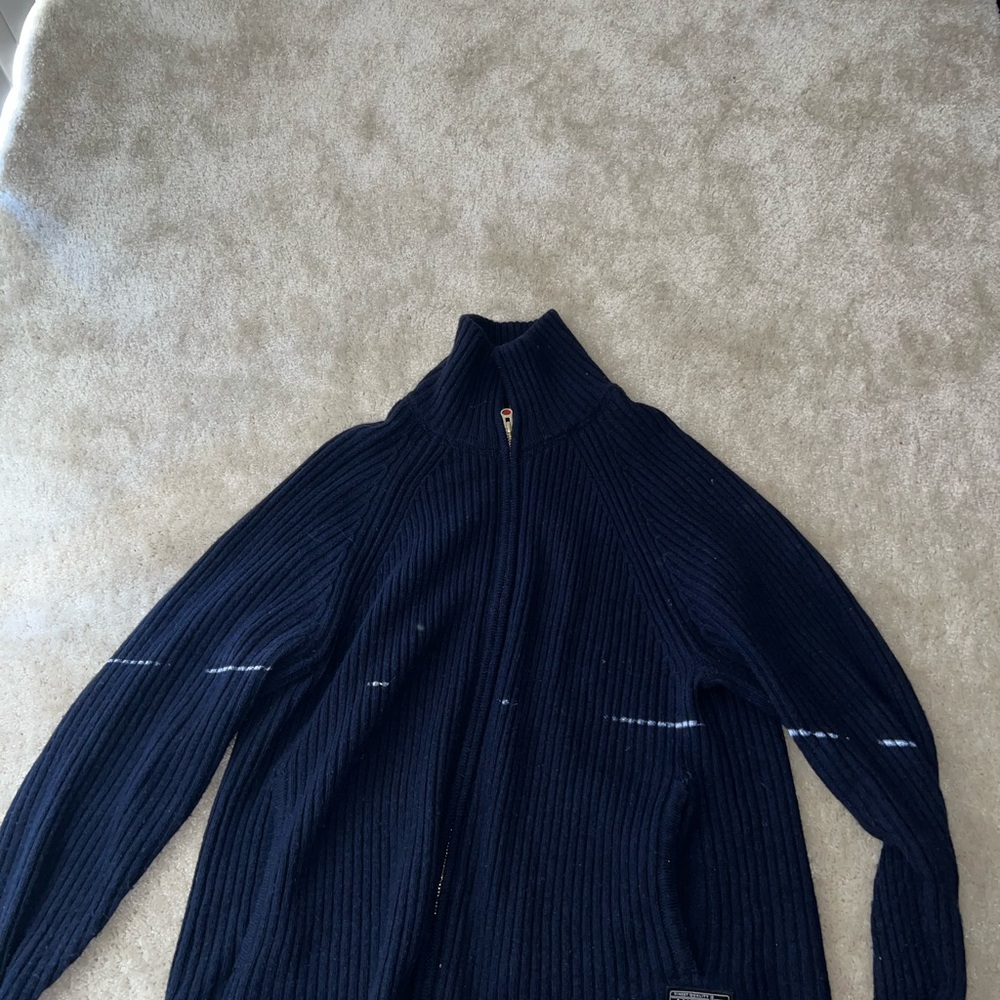Blue Zip Up Sweater with High Collar and Textured Fabric